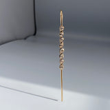 Nexus Needle 14k gold modern earring 